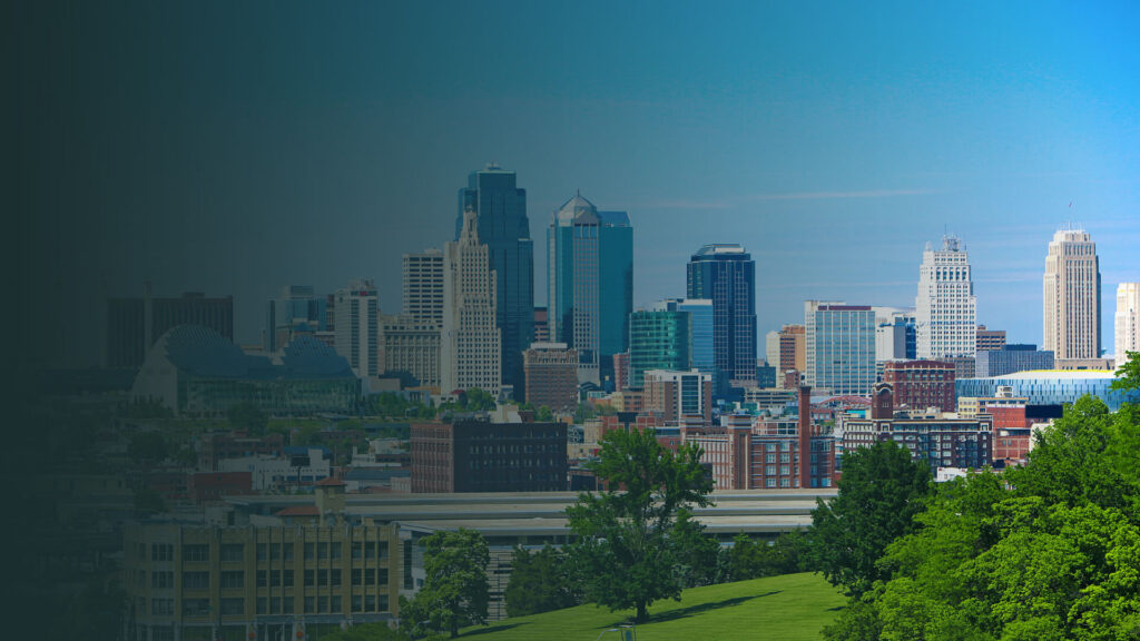 Kansas City, Missouri skyline with downtown buildings and the cityscape visible in the distance.