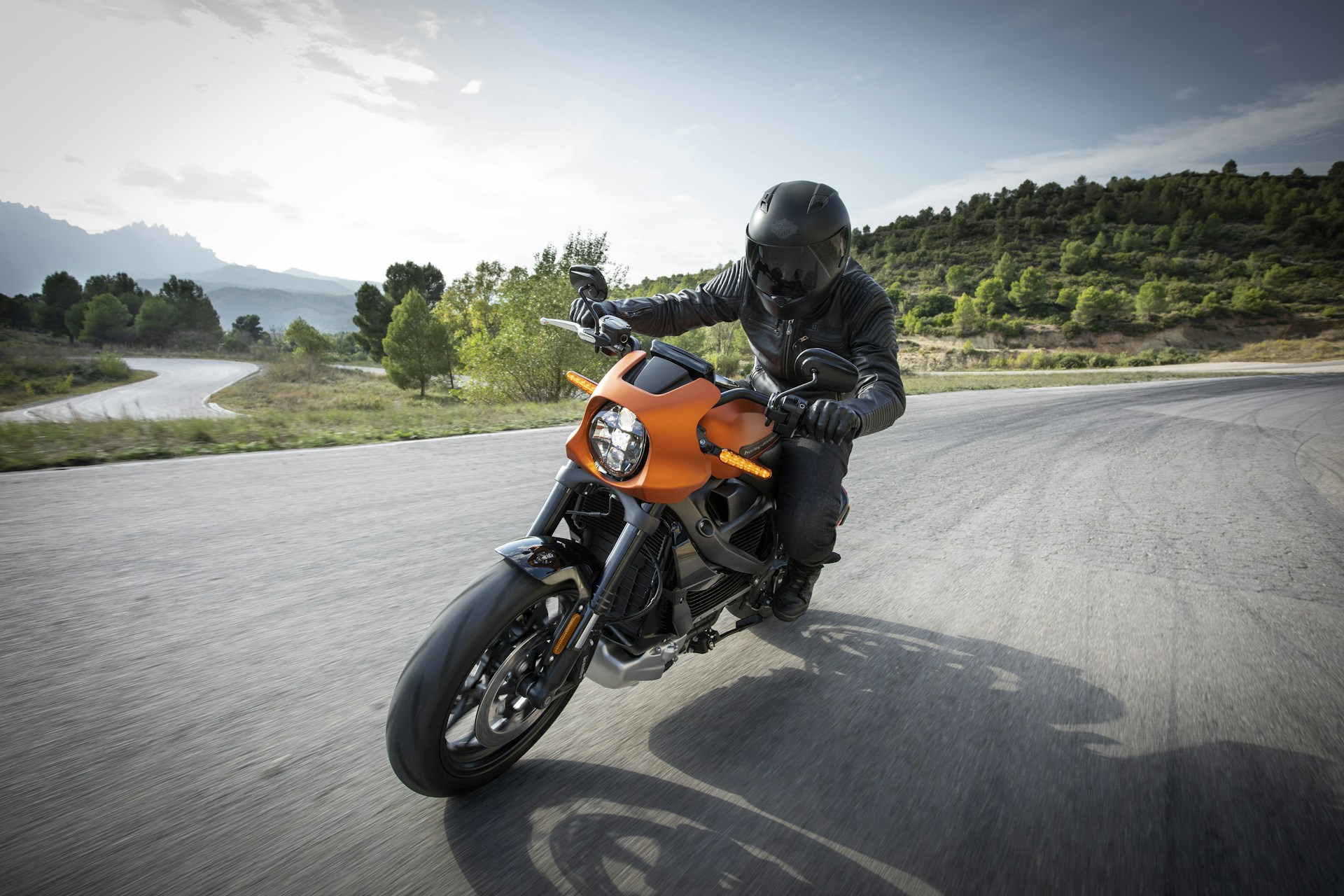man riding a motorcycle fast